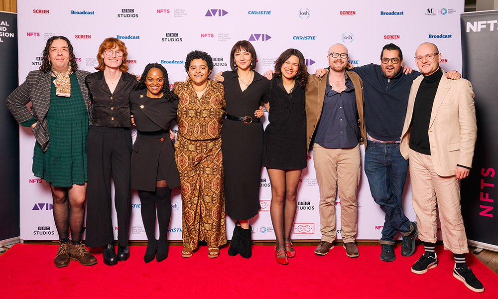 screenwriting cohort 2025 posing for photo at graduation